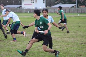 a student playing ultimate frisbee at SLAMT 2020